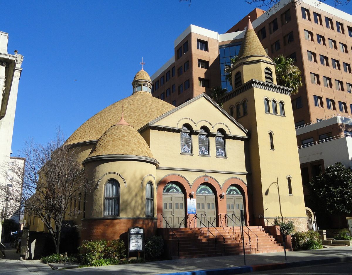 The domes and arched window of the First Unitarian Church on St. James Park
