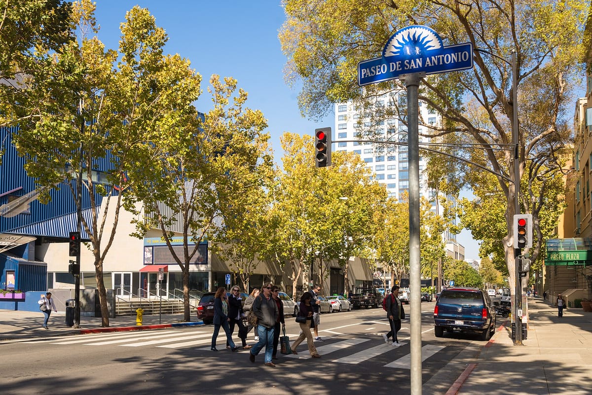 People walking on the Paseo de San Antonio