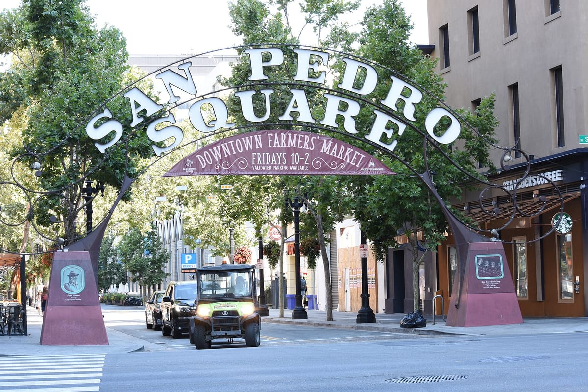 Outdoor tables and string lights in San Pedro Square